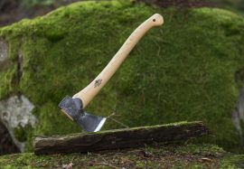 Axe on mossy log